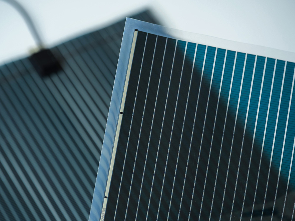 Close-up of ST-OPV organic thin-film solar cell, showing its translucent multilayer structure
